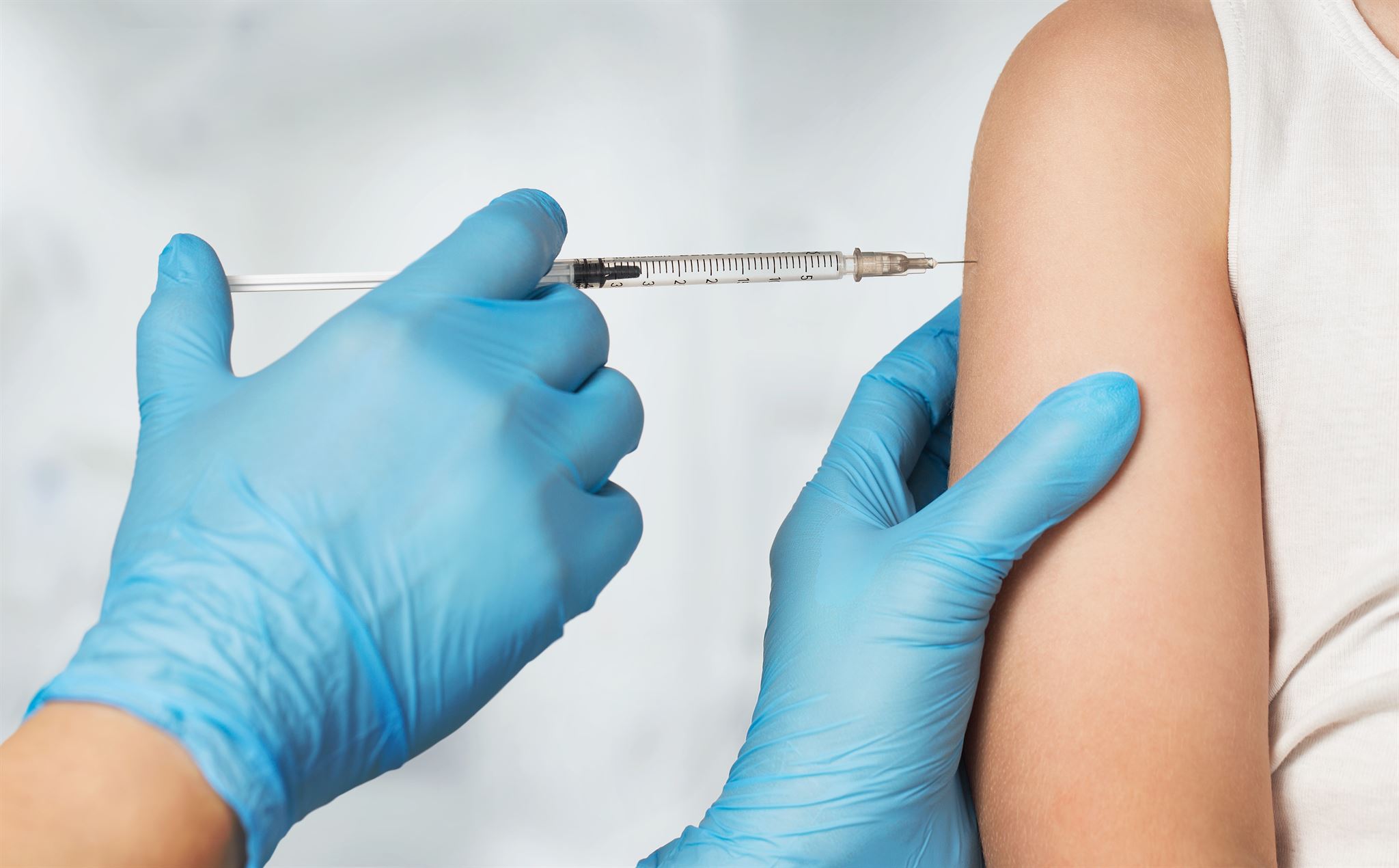 Close-up-of-arm-receiving-an-needle